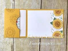 an open card with sunflowers on it