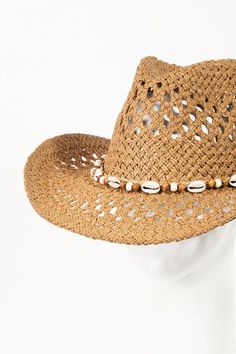 The Cowrie Shell Beaded String Straw Hat is a unique and visually striking accessory that combines cowrie shells, beads, and string on a classic straw hat. This bohemian-inspired design creates a trendy and eclectic look perfect for summer. The cowrie shells and beads add a touch of natural beauty and texture to the hat, giving it a beachy and whimsical feel. The string detailing enhances the aesthetic appeal of the hat, adding a decorative element that sets it apart from traditional straw hats. Boho Hat, Cowrie Shells, Straw Hats, Rick Rack, Cowrie Shell, Bead Stringing, Shell Beads, Color Ivory, Wide Brimmed