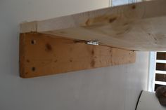 a piece of wood is hanging on the wall