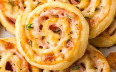 some food that is on top of a plate and has been cut in half to look like pretzels