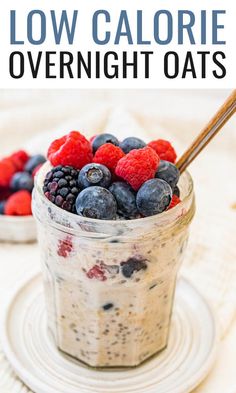 an oatmeal in a jar with berries and blueberries