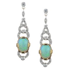 A pair of Art Deco style natural Australian opal and diamond drop earrings, each earring comprising an oval shape natural opal to the center of an open work diamond-set cluster above and below. Elegant and feminine, these articulated pendant earrings and their joyful rhythm are gorgeous for a night out or as fine statement earrings on your little dress. Information Style: Art-deco Metal: 14K Yellow Gold Width: 10 mm. Length: 40 mm. Weight: 8.65 g. (approx. in total) Backing: Push Back Center Gem Opal Earrings Vintage, Vintage Drop Earrings, Nouveau Jewelry, Gold For Sale, Art Nouveau Jewelry, Estilo Art Deco, Art Deco Diamond, Victorian Jewelry, Diamond Drops