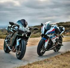 two motorcycles parked next to each other on a road