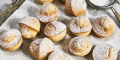 powdered sugar covered pastries on a tray