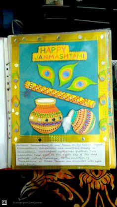 an open book with the words happy janmash written on it and decorated items