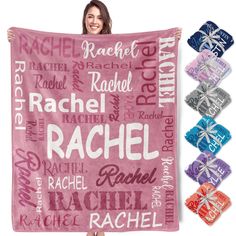 a woman holding up a pink blanket with names on it and the words rachel written in different languages