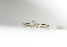 A gorgeous 14k yellow gold round band ring featuring a beautiful natural prong set marquise cut genuine diamond and a small accent diamond. Show a little love to yourself or someone special. This would be great on its own, or as an engagement ring. Diamond : This is a beautiful 1.75mm round genuine diamond. Gemstone : marquise cut genuine diamond measuring 5 x 3mm set in 14k yellow gold. Mark size at checkout. Let me know if you have any questions! Follow jenhoughdesigns on insta Jenhoughdesigns Dainty 14k Gold Marquise Cut Diamond Ring, Dainty Marquise Diamond Ring In 14k Gold, Dainty Marquise Diamond Ring With Brilliant Cut, Delicate Marquise Diamond Ring In 14k Gold, Delicate 14k Gold Marquise Diamond Ring, Delicate Marquise Diamond Ring In Yellow Gold, Delicate Marquise Cut Yellow Gold Diamond Ring, Tiny Diamond Ring, Sturgeon Bay