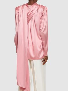 Non-detachable draped scarf panel. Asymmetrical construction. Model is wearing a size36 Formal Pre-draped Draped Blouse, Elegant Silk Tops With Asymmetrical Hem, Elegant Silk Top With Asymmetrical Hem, Silk Draped Blouse, Satin Silk Top, Long Sleeve Wrap Top, Draped Blouse, Draped Top, Magda Butrym