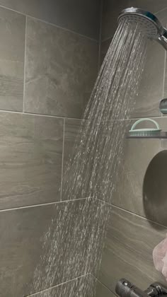 a shower head with water coming out of it