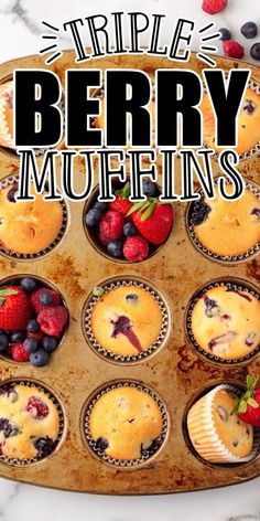 a tray filled with muffins topped with berries and blueberries