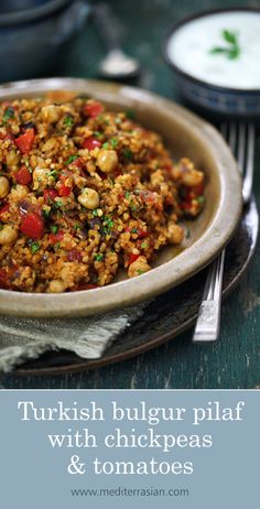 a bowl filled with food sitting on top of a table