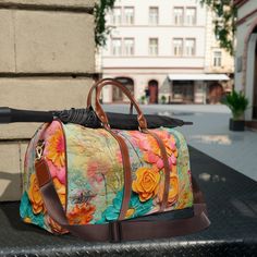 Embrace your inner flower child with our Boho Retro Flower Power Waterproof Travel Bag. Adorned with vintage florals, this bag is perfect for your next adventure. Stay stylish and organized with this functional and trendy accessory! This personalized travel bag is all about style. Made with high-grade waterproof nylon, it's a highly durable means of transferring your essentials wherever you go. With multiple compartments, a resilient carrying handle, and an adjustable shoulder strap, it's the perfect companion for all your adventures. .: High-grade nylon material.: Microfiber PU leather top handle and binding.: One size: 20" × 12'' × 9" (50.8cm × 30.5cm × 23cm ).: Brown PU leather handles and an adjustable shoulder strap.: Polyester lining.: Gold-colored zipper .: All-over print 20" x 12" Green Floral Print Travel Bag, Casual Travel Bag With Floral Print, Casual Floral Print Travel Bag, Rectangular Travel Bag With Floral Print, Floral Print Shoulder Bag For Travel And Spring, Floral Print Shoulder Bag For Spring Travel, Brown Floral Print Shoulder Bag For Travel, Spring Travel Retro Bag, Vintage Multicolor Travel Bags