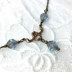 A delicate necklace with a dainty floral antique brass chandelier pendant and a czech glass bicones. These beads are so aqua they almost look like little blue rain drops. The size of the beads is 8mm. You can choose the desired length in the drop down menu. The jewelry will be sent in a cozy gift box and packed in a mailing box, or air bubble envelope for extra protection whilst in transit. -------------------------------------------------------------------- All material is lead and nickel-free. Antique Brass Chandelier, Czech Glass Necklace, Vintage Style Necklace, Blue Rain, Chandelier Pendant, Cozy Gift, Vintage Style Jewellery, Brass Chandelier, Floral Necklace