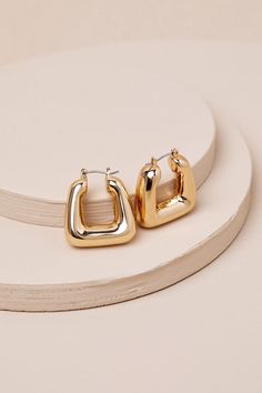 You'll look exquisite from every angle with accessories like the Lulus Precise Perfection Gold Geometric Hoop Earrings! Shiny gold-toned metal shapes these trendy earrings that feature a twist on the classic hollow hoop design thanks to a squared, geometric-inspired silhouette that will make any of your 'fits extra stylish. Hinged Post Backs. 1" Long And 0. 75" Diameter. 100% CCB. Imported. Lulus | Precise Perfection Gold Geometric Hoop Earrings. Earrings Square, Geometric Hoop Earrings, Geometric Inspiration, Hoop Design, Earrings Geometric, Trendy Earrings, Accessories Jewelry Earrings, Square Earrings, Gold Geometric