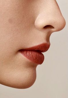 a woman's face with her nose slightly closed