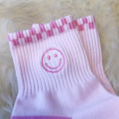 "Smiley Socks - Our new embroidered athletic socks are so fun!  Our pink smiley face style features a smiley against a pastel pink sock with checkerboard trim & \"Be Kind\" on the soles - SO SO CUTE!!   Perfect for adding good vibes to your feet!  Soft & cozy, our socks are made of 95% cotton & 5% spandex.  Perfect for wearing with your sneakers!  ♥ Size: Women's one-size fits most ♥ Materials: cozy & soft 95% cotton & 5% spandex ♥ Designed by & exclusive to Wildflower + Co.  ♥  Imported ♥ Inclu Comfortable Pink Cotton Socks, Pink Comfortable Socks For Gift, Comfortable Pink Socks For Gifts, Comfortable Pink Socks As A Gift, Comfortable Pink Socks For Gift, Fun Pink Socks For Winter, Smiley Socks, Pink Smiley Face, Pink Smiley