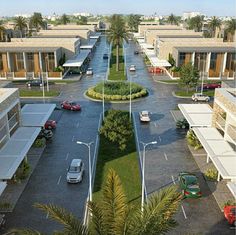 an aerial view of a parking lot with cars parked on the street and palm trees