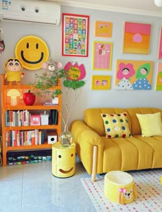 a living room filled with furniture and pictures on the wall