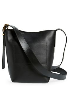 Madewell's newest leather bag collection is cool, modern and quietly luxe. With a magnetic closure and interior pocket, the mini bucket tote is perfectly sized to hold your phone, wallet, keys and more—plus, it has a shoulder strap and adjustable crossbody strap. It's so good, it's essential. Structured silhouette with flat base for stability Leather Imported Modern Rectangular Bucket Bag For On-the-go, Versatile Everyday Bucket Bag With Magnetic Closure, Minimalist Workwear Bags With Gold-tone Hardware, Minimalist Work Bags With Gold-tone Hardware, Minimalist Bucket Bag With Removable Pouch For On-the-go, Versatile Bucket Bag With Magnetic Closure For Everyday Use, Rectangular Travel Bucket Bag With Magnetic Closure, Daily Use Bucket Bag With Magnetic Closure, Modern Everyday Bucket Bag With Magnetic Closure