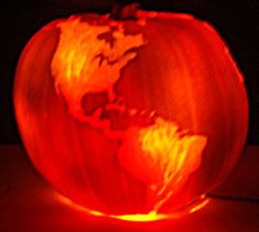 a pumpkin carved to look like the earth