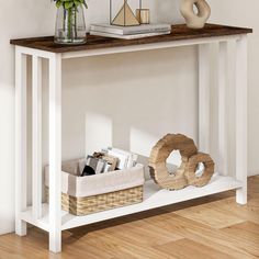 a white table with baskets and books on it