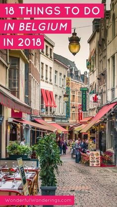 an outdoor restaurant with tables and chairs in the middle of a cobblestone street