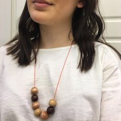 The Wooden Bead necklace features wooden beads on a thin orange cord. It measures 23" long, including the lobster clasp. Feel free to contact me for additional sizing inquiries, as most times I can accommodate custom lengths. Alternatively, leave a note at checkout if you'd like me to include a chain extender on the necklace. Care Instructions To prevent your necklace from tarnishing quickly, store it by itself in a cool, dry place, being careful not to get it wet (i.e. do not store them in your Wooden Bead Necklace, Necklace Orange, Wooden Bead Necklaces, The Lobster, Bead Necklaces, Jewelry Safe, Chain Extenders, Paper Tape, Leather Necklace