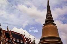 an ornate building with a steeple on the top and sky in the back ground