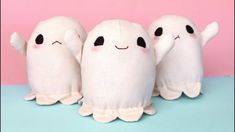 three stuffed ghost dolls standing next to each other