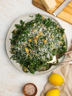 lemon kale caesar salad with parmesan cheese and fresh herbs on the side