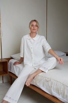 Most adorable linen pajama set for women in white eco linen. The linen loungewear luxury with delicate cotton lace Nice trapeze style short jacket with Peter pan collar and long pants with delicate cotton lace decoration at jacket and pants bottoms. This stunning  pajama you can buy as a wedding, birthday or anniversary gift. ITEM DETAILS: Jacket: - Short trapeze shape jacket   - Buttoned down front  - Peter Pan style collar - 3/4 length sleeves - Jacket back length - 23" (58.5cm) - At jacket bo Cotton Pyjama Set Women, White Pajamas Aesthetic, Lounge Wear For Women, White Feminine Sleepwear For Relaxation, Feminine White Lounging Sleepwear, White Relaxed Fit Sets For Daywear, Spring Linen Sleepwear For Home, White Feminine Sleepwear With Relaxed Fit, White Summer Relaxation Sets