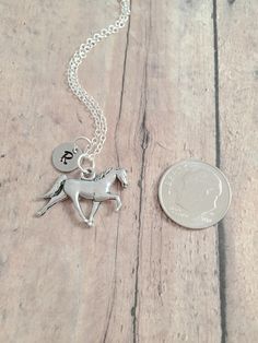 "This listing is for a hand stamped initial necklace featuring a 3/5\" x 7/10\" pewter Tennessee walking horse charm & 3/10\" stainless steel initial pendant. The silver plated chain is 18\" long, but can be made to your desired length- see last photo in listing for length guide. Please indicate the chain length you would like in the 'notes to seller' section at checkout. All items are lead & nickel free. Message me with any questions, thank you! Add an initial to any necklace: https://w Personalized Silver Horseshoe Jewelry, Tennessee Walking Horse, Jewelry Western, Walking Horse, Tyler Tx, Horse Necklace, Horse Jewelry, Horse Gifts, Western Jewelry