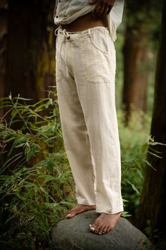 Introducing our handmade Marial Pants, crafted from 100% hand-woven khadi cotton. These soft and breathable trousers offer unrivaled comfort, perfect for yoga, festivals, and everyday living.The design features two conveniently placed pockets, adding a practical touch to your daily endeavors. Furthermore, a string tie allows for a personalized fit, ensuring maximum comfort and freedom of movement.These boho pants are suitable for both men and women, and specifically tailored to offer exceptional Relaxed Fit Linen Yoga Pants, Traditional Linen Pants For Summer, Traditional Linen Summer Pants, Traditional Summer Linen Pants, Traditional Linen Straight Pants, Fisherman Clothing, Men Cream, Funky Design, Boho Pants