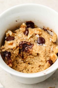 a bowl filled with oatmeal and chocolate chips on top of a table