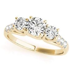 three stone engagement ring in yellow gold with diamonds on the sides and four stones at the top