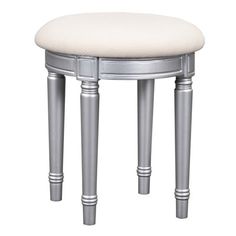 a silver stool with a white cushion on top