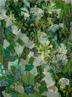 an image of a patchwork quilt with green leaves and plants on the bottom half