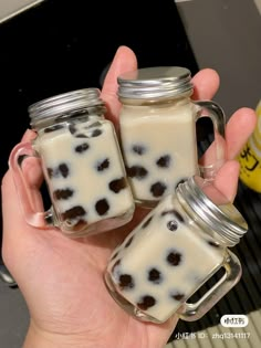 two mason jars filled with white and brown liquid