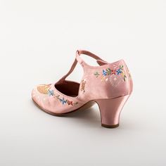 As hemlines rose in the 1920s, flashy footwear was all the rage, and the Daisy Embroidered T-Strap heels are just the ticket. Made in luminous satin heavily embroidered in a gorgeous botanical design, the Daisy T-Strap Shoes are closely based on an original pair in Bata Shoe Museum. These gorgeous shoes are accurate for the 1920s, 1930s, and 1940s, and offer our refined and stable 2.5 in / 6.3 cm Spanish heel paired with open sides and an almond toe. Wear Daisy embroidered 1920s shoes with any g Bata Shoes, 1920s Shoes, American Duchess, T Strap Shoes, Silk Stockings, T Strap Heels, Botanical Design, Fabric Shoes, Strap Shoes