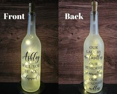 two bottles that have lights in them and one has a message on the bottle with words