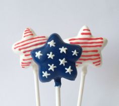 three patriotic lollipops with stars and stripes on them