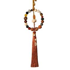 a tasseled beaded necklace with an orange tassel hanging from it's end