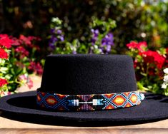 Dress up any hat with this western beaded leather hat band. Beautiful native patterns with vibrant colors. Bring a southern charm to your old favorites with this gorgeous hat band or make your new hat even more special. Made of full grain leather (highest grade leather) and glass beads. Handmade in Brazil by artisan women. You can match your hat band with our best-selling leather beaded dog collars! Treated with beeswax, water resistant. 30 days free returns or exchange. 1-year warranty. One siz Artisan Multicolor Hat Bands For Country Events, Bohemian Beaded Brimmed Hat Bands, Bohemian Multicolor Hat Bands For Country Events, Western Multicolor Hat Bands For Country Events, Southwestern Multicolor Hat Band For Country Events, Southwestern Style Hat Bands For Festival With Flat Crown, Western Style Multicolor Hat Bands For Country Events, Southwestern Style Hat Bands For Rodeo With Flat Crown, Bohemian Festival Hat Bands With Flat Crown