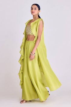 Lime longline tissue cape in a ruffled pattern. Comes with solid sharara and sequins, thread work, cutdana embroidered padded blouse. - Aza Fashions Green Ruffled Sets With Traditional Drape, Festive Ruffled Cape Sleeve Sets, Festive Sets With Ruffles And Cape Sleeves, Georgette Sets With Ruffles And Cape Sleeves, Spring Sharara With Ruffles, Spring Ruffled Sets For Receptions, Spring Reception Ruffled Sets, Spring Reception Sets With Ruffles, Spring Festive Sharara With Ruffles