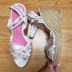 This Pair Of Shoes Is New With Tags. Has Minor Wear From Storage And Has Some Manufacturer Flaws As Shown In The Braided Wedge Of The Heel. Has A Very Dainty And Elegant Floral Pattern On The Straps With White Base. Would Make A Great Shoe To Complement A White Dress. Would Be Good For Bride For Wedding Events Such As Engagement Photos And Rehearsal Dinner. Offers Welcome. Size 10.5 White Round Toe Wedge Sandals For Spring, White Closed Toe Wedge Sandals For Spring, White High Heel Wedge Sandals For Spring, White Wedge Heel Sandals For Spring, White Wedge Sandals For Spring, Cream Wedge Heels For Spring, White Wedge Sandals With Removable Insole, White Medium Width Wedge Heels, White Wedge Sandals With Branded Insole