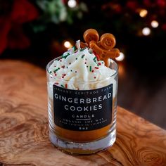 a gingerbread cookie in a glass container on a table