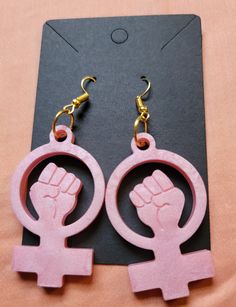 Feminist resin earrings made to order with your favorite color(s). I will be donating 20% of profit to NARAL Pro-Choice America. Handmade and every product will be unique. Product make take up to three weeks to completely harden initally. Resin Product Care: * Keep out of direct sunlight *Do not place in dishwasher (wipe down with damp cloth only) *Fragile, please handle with care.  *High temperature can cause product to become flexible and bendy. Place product in cold area to harden again. Retu Feminism Earrings, Feminist Gifts Shop, Feminist Accessories, Feminist March Signs, Feminist Earrings, Feminist Aesthetic, Become Flexible, Resin Product, Modern Feminism