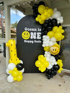 balloons are arranged in the shape of giraffes and letters that spell out ocean is one happy dude