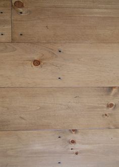 the wood floor has been made with different types of planks and is very light brown