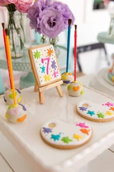 decorated cookies and candles on a table